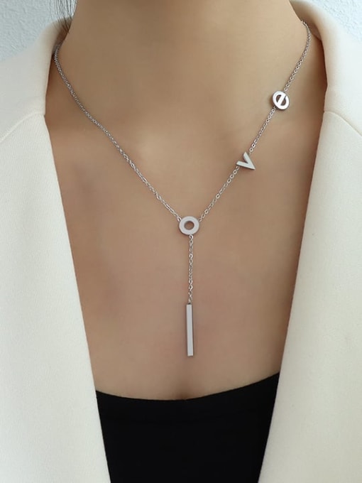 Necklace in titanium steel with space out letters stating L O V E